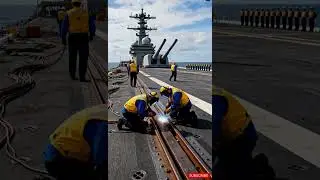 Welding Steel on an Aircraft Carrier Deck in the Open Sea