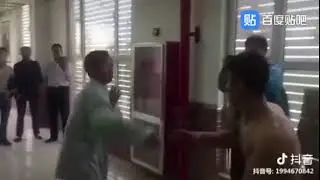Fake Tai Chi master Ma Baoguo with a young guy
