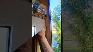 The dog watches the fastening of the imitation bar (Собака наблюдает за креплением откосов в доме)