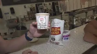 Mike Polk Jr. tries chip dip ice cream at Pav's Creamery