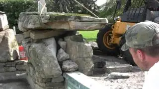Setting Natural Stone Boulders to Create a Grotto Waterfall for this Swimming Pool Remodel