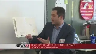News 8's Brian Spyros reads to children for Read Across America Event