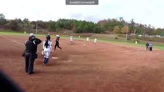 Chloe StJohn (shortstop) fields a ground ball and makes the play at first base
