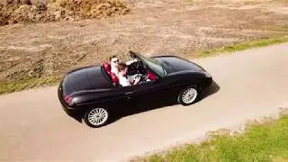 Cruising with a Fiat Barchetta through the meadows