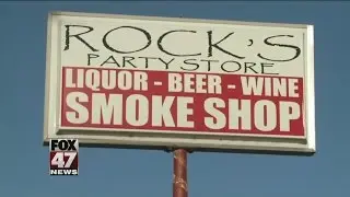 Men rob Lansing party store with assault rifles, shotgun
