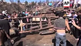 Destruction after uncontrolled fire rages through hillside neighborhoods