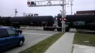 DM&E and IC&E power lead a westbound mixed freight