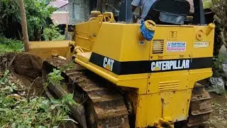 Caterpillar D4C bulldozer in action - Philippines.