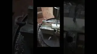 Drilling on round bar using v block