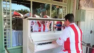 Mickey Mouse Club March played on ragtime piano in Magic Kingdom