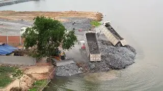 Starting The project is progressing perfectly right now Dozer Pushing Stone With Trucks Loading