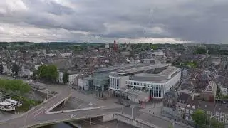 Aerial view of a Mosae Forum shopping mall amidst historic architecture in Maastricht, highlighting