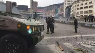 Bolivian police stand guard after violent clashes in La Paz | AFP