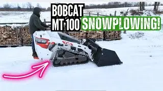 Мини-погрузчик с бортовым поворотом и гигантским ковшом снегоочиститель