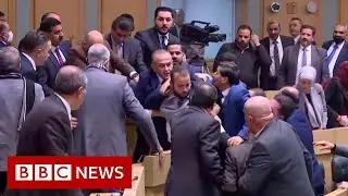 Fist fight in Jordan's parliament caught on live stream - BBC News