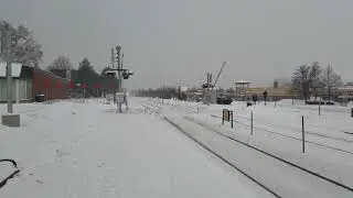 Metra train clearing snow on railroad crossing