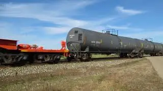 CN 2655, BC 4617, CN 2578 speeding with a Westbound freight train that has a Kasgro Rail flat car.