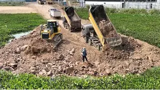 The Best Team Work Bulldozer  Push Stone In Water To Construction New Road