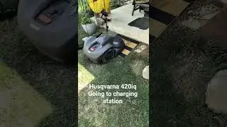 Husqvarna 420iq going to the charging station located on the patio