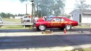 burgandy nova at 710 drag strip picking up the tires