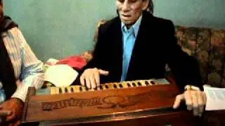 Master Manju plays the Harmonium
