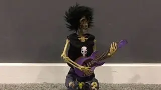 Halloween animated guitar playing skeleton