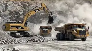 Raw Power: Massive Excavator vs. Heavy Dump Truck.