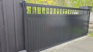TGV Sliding gate. Black with pedestrian gate. Bar top.
