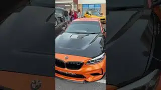 HIGHLY modified orange BMW spotted at city smokers UK car meet