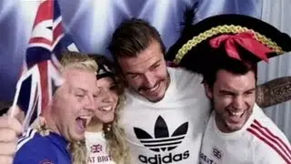 David Beckham 'Photobombs' Soccer Fans in Booth