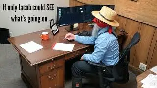 An Amish man working on a computer? Jacob's first day working in an office.