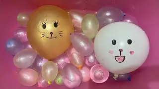 Popping Cute Face Balloons with a Needle &ndash; Water Balloon Fun!