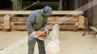 Man makes curly cutting wood Chainsaw. The log will be part of the future of the wooden house