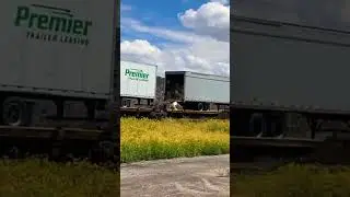Train theft of packages scattered on railcar from criminals stealing then leaving semi trailer open