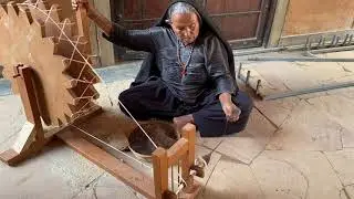 Project LooM: Gujarat Edition: a spinner converts camel wool into yarn at Khamir.