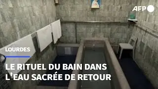 Au pélerinage de l'Assomption, les croyants de Lourdes renouent avec le rituel du bain | AFP