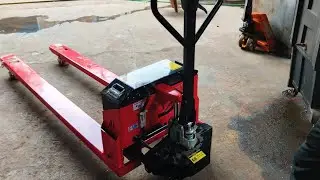 Electric pallet truck with long forks