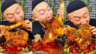 Big Ice Bro is thoroughly enjoying his beef tendons, savoring their tender and chewy texture.