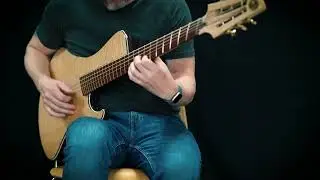 Mousetrap studios 6-string baritone guitar, with a flamed maple top and back.