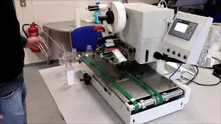 Labelling of flat bottles automatically with the JMV LAB510 Labeler Series