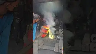 Artisans are pouring molten brass to make a ship propeller worth hundreds of thousands of taka.