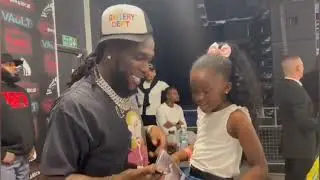 Burna Boy Meets A Young Fan And Is Gifted A Bracelet During Meet And Greet In Birmingham
