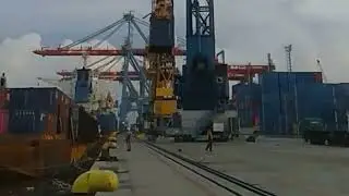 Sea Container Terminal in the seaport. Loading of a cargo vessel with containers. IEC.