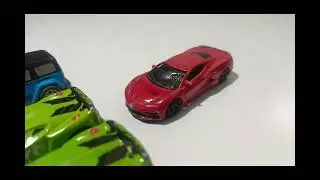 WHITE AND BLUE JEEP GREEN AND RED CARS READY FOR RIDE