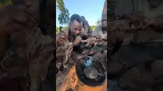 Traditional Hadzabe cooking: monkey meat roasted in the wild.