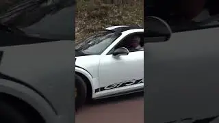 Porsche 911's leaving the car meet