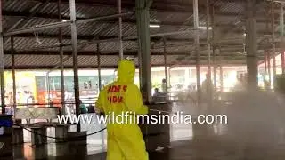 Railway, Bus platform disinfected, migrant workers file towards bus in Gorakhpur, Uttar Pradesh