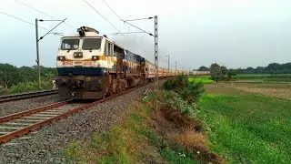 Powerful diesel engine pulled Maldatown Intercity express over the beautiful village