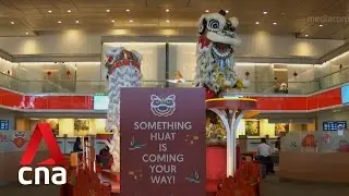 Long queues at bank branches, ATMs as people collect new notes for Chinese New Year