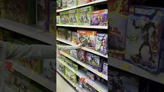 Sophia loved exploring the Lego aisle at Walmart! 🎄✨
